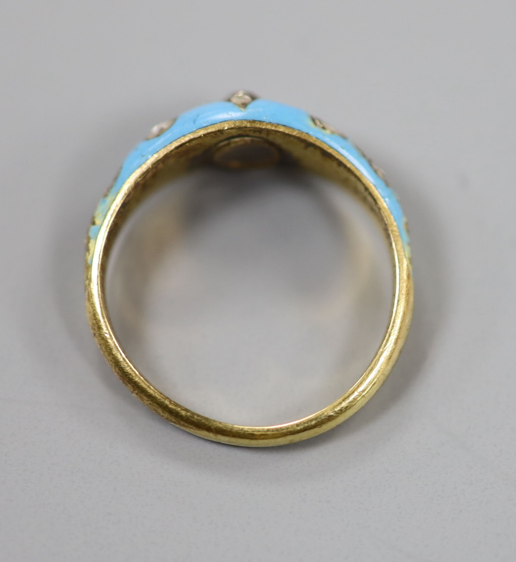 A late Victorian yellow metal, enamel and rose cut diamond set dress ring(a.f.), size L/M, gross weight 4.9 grams.